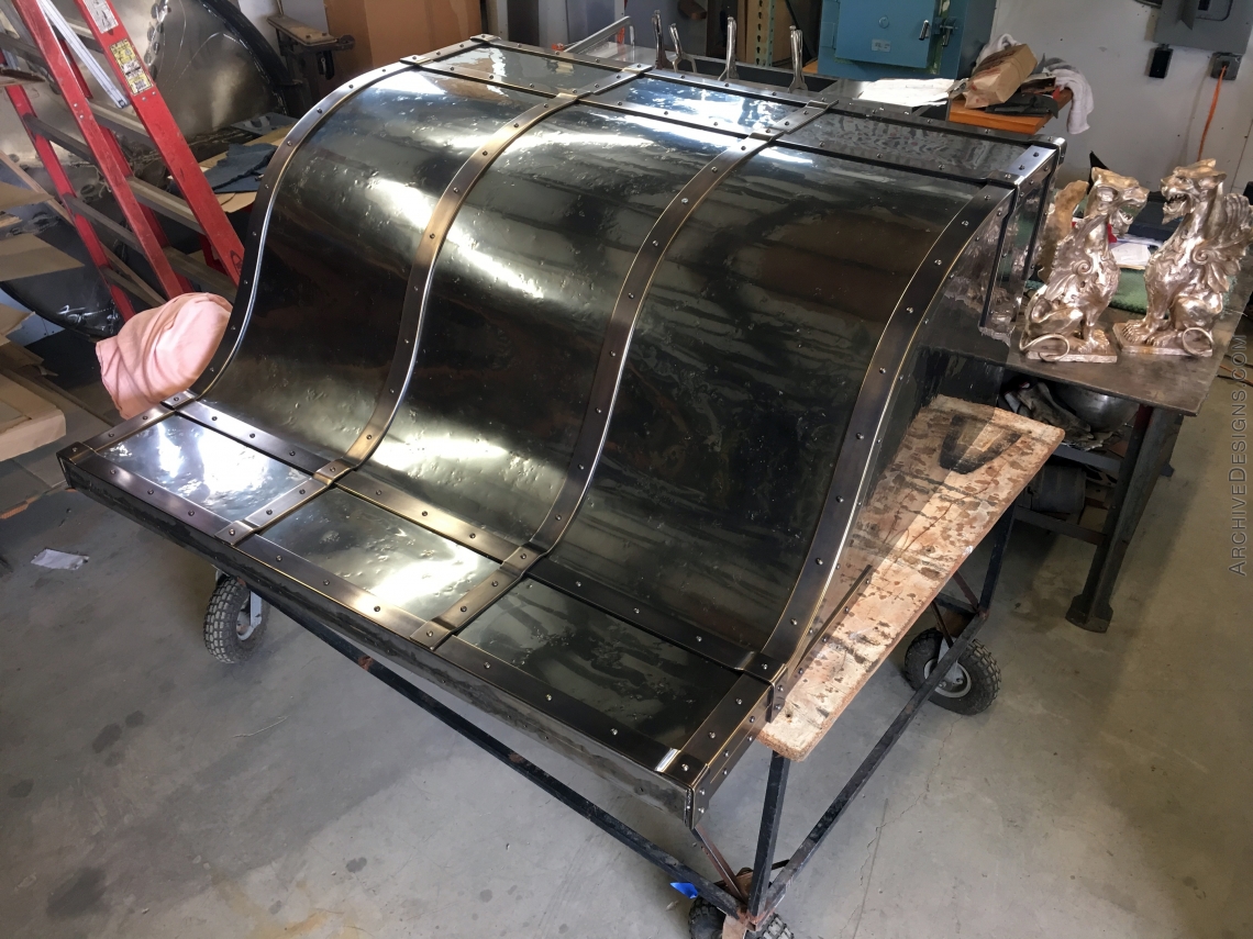 Hood in progress, distressed stainless with burnished brass straps